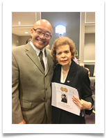 Raqui and Paul Ruiz with the Certificate from Congress for Ed