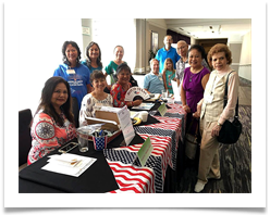 Alice Benitez beside Raqui with the PSHS staff at the reception desk