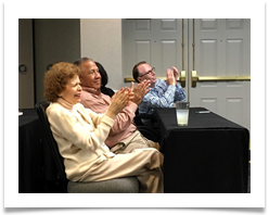 Doug Ramsey, Marvin Dumlao and Raqui applaud Alice Benitez during her presentation