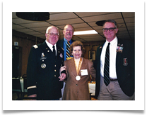 Col. Sam Young, Maj. Bob Seals and Trooper Tim Riley with Raqui