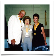 Fred Klink, VP U.S. Cavalry Association and his wife join Raqui during the Cavalry banquet