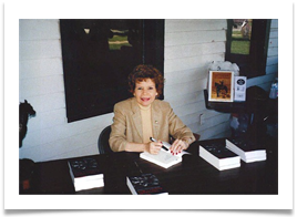Raqui signing Ed's books at the Headquarters of the U.S. Cavalry Association