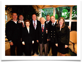 Ed poses with BG Dave Snowden, Chief of Police of BH, 4th from left and Katie Kohler, Executive Director of the PenFed Foundation